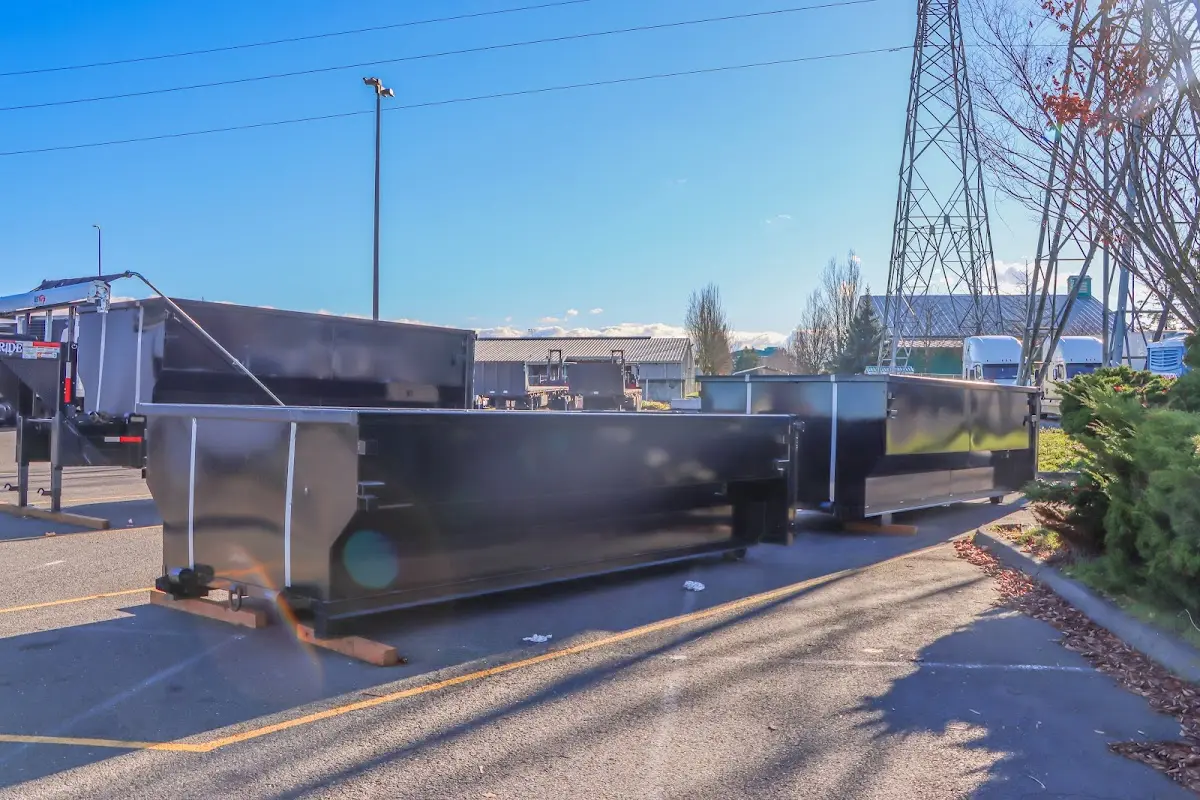 Roll-off dumpster ready for waste disposal at job site for 4 Yard Dumpster Rental in Chackbay